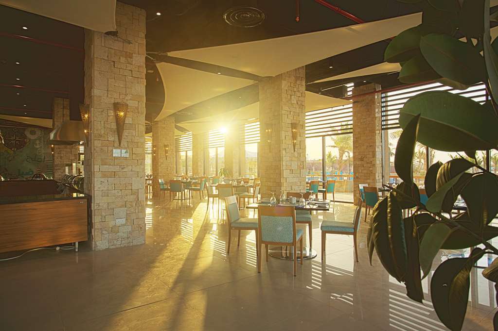 Golden Tulip Sharma Resort Restaurante foto